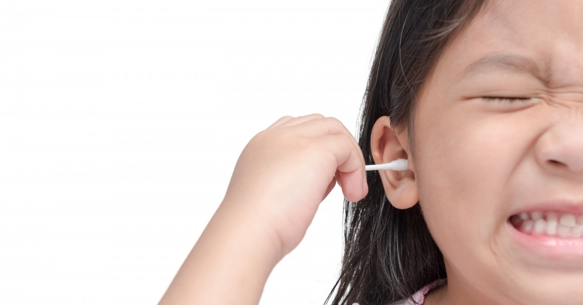 Child Using a Cotton Swab in Pain