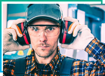 Man wearing hearing aids in construction