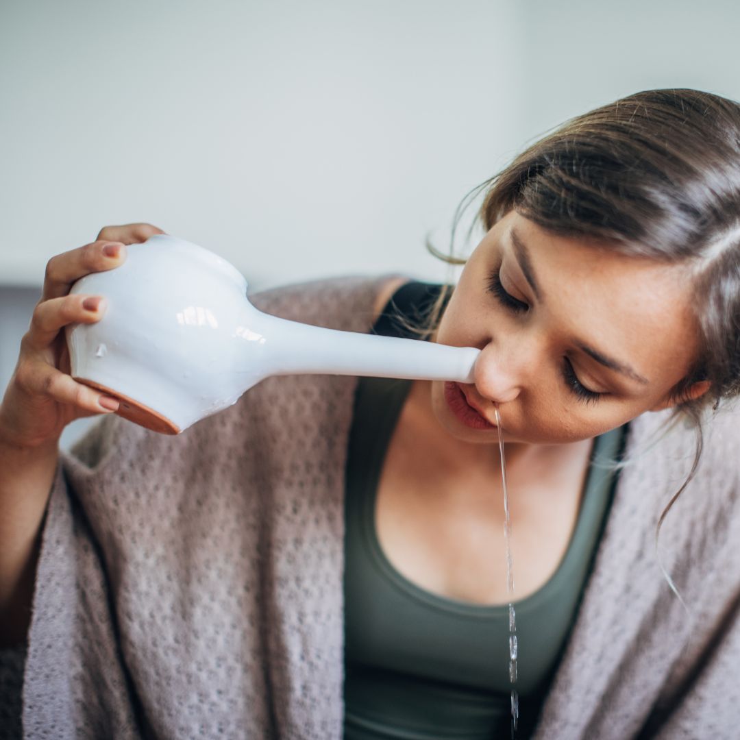 person using neti pot