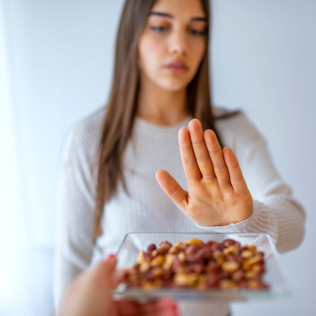 person avoiding eating nuts